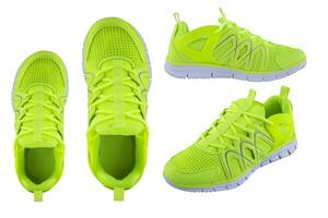 Sneakers bright green.. Sport shoes on a white background top view photo