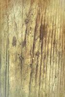 The texture of an old wood board with scuffs and scratches. photo