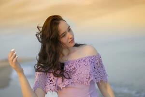 Young ordinary girl against the sky and sea photo