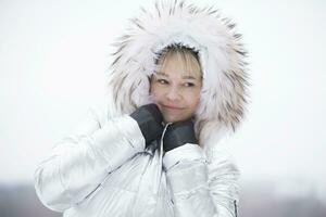 Woman in a furry furry hood photo