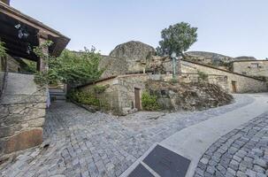 Scene of a deserted street from the historic town of Monsanto in Portugal photo