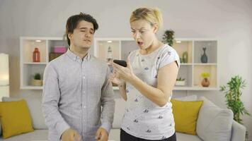 The phone runs out of charge and the mother and son get angry. video