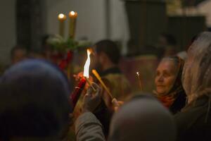 Belarus, Gomel, May 01, 2016. Nikolsky monastery.Celebration of Orthodox Easter.People in the church near the candles. Holy fire photo