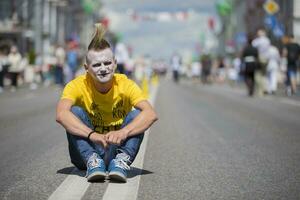 Belarus, the city of Gimel, July 03, 2019. Youth Festival.Punk in bright clothes on a city street photo