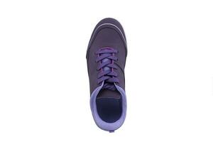 Sneaker purple on a white sole. Sport shoes on a white background. photo