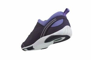 Sneaker purple on a white sole. Sport shoes on a white background. photo