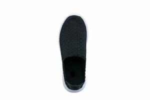 Black sneakers on white soles. Sport shoes on a white background. photo