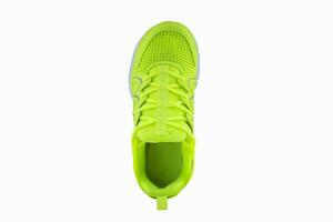 Sneakers bright green.. Sport shoes on a white background top view photo