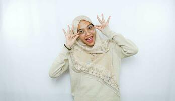 portrait of happy young asian woman wearing hijab isolated on white background photo