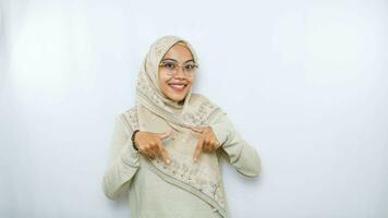 happy young asian woman in casual shirt. Charming female lady open hands palm up holding something on isolated White background. photo