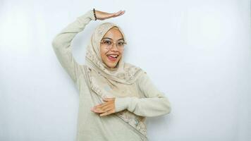 portrait of happy young asian woman wearing hijab isolated on white background photo