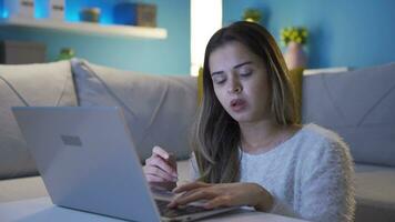 Bored unhappy young woman using laptop. video