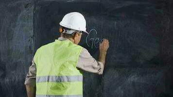 Engineer man writes Generator on the board. video