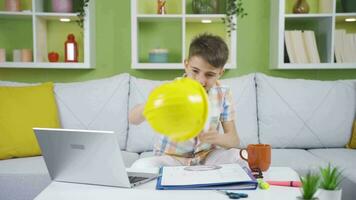 Cute little boy wearing a helmet and playing the role of an engineer. video