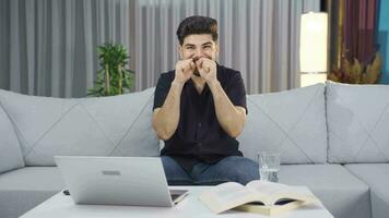 The young man rejoicing at the good news is happy. video