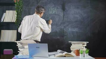 The historian man writing Christopher Columbus on the blackboard. video