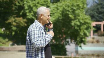 The man is very happy when he receives the good news on the phone. video