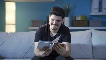 Emotional man looking at old photos. video