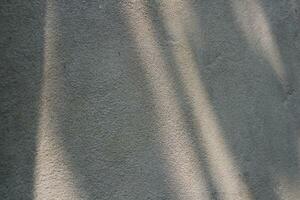 Cement and brick wall texture background, sun rays on the cement wall surface, smooth cement wall backdrop photo