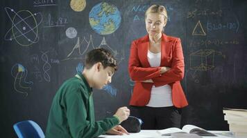 The teacher puts a girl student to an exam and the student fails. video