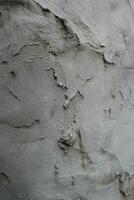 Uneven cement and sand wall texture background, grungy cement wall surface, rustic sand wall photo