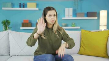 The young girl solemnly gives a stop warning, says no. video