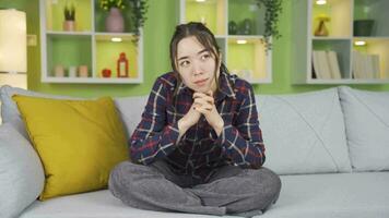 Portrait of thoughtful Asian teenage girl. video