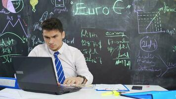 Businessman writes euro on the board and feels happy. video