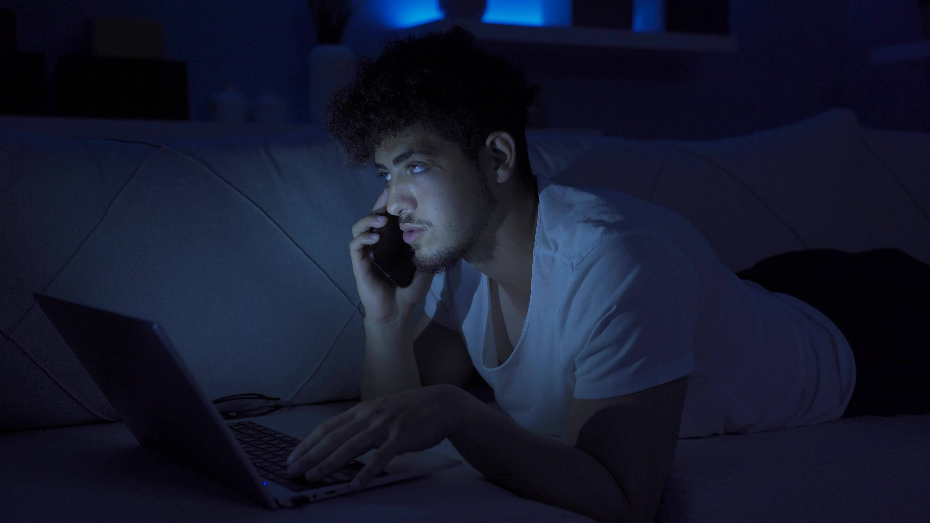 Young man making phone call at night, feeling happy. 32425158 Stock