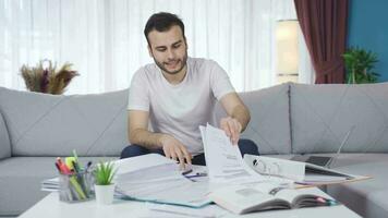 Stressed teenager works in his home office and his business is not going well. video