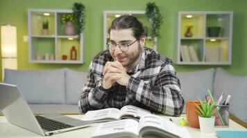 Young man focusing on laptop impatiently and excited. video