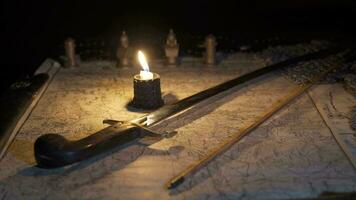 Battle plan on a candlelit map in ancient times. video