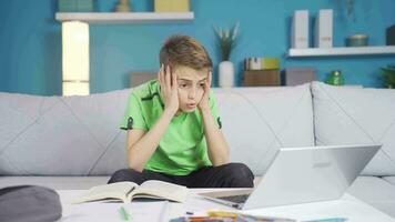 Little boy is upset looking at exam results. video