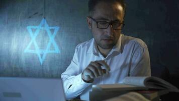 The historian man writing The Birth of Judaism on the blackboard. video