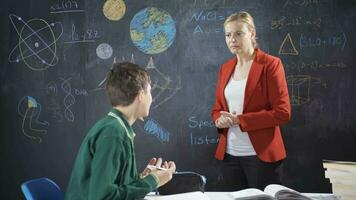 Teacher lectures girl student, teacher gets angry with student. video