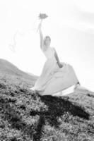 Beautiful bride with pinwheel black and white photo