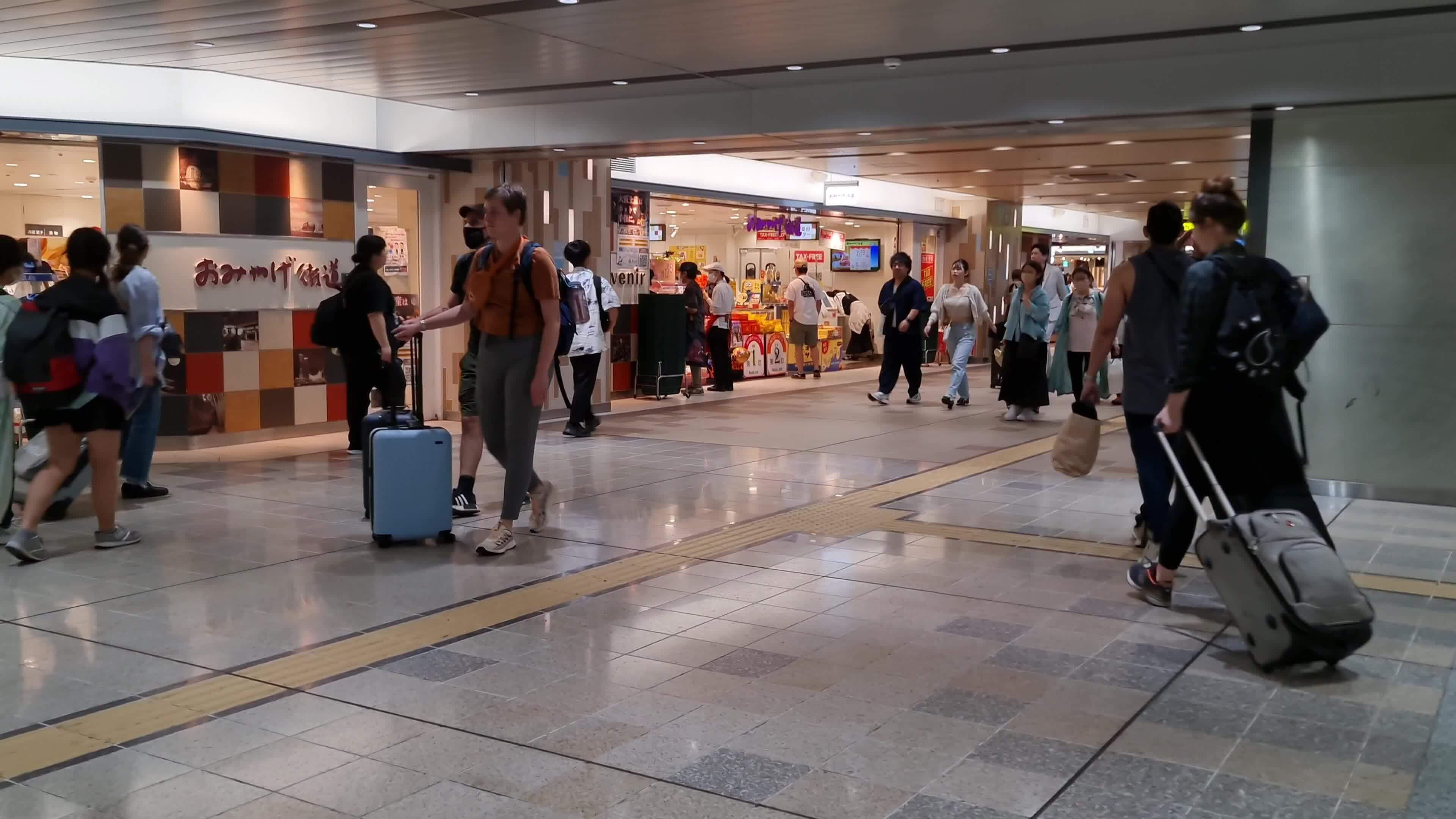 Osaka, Japan on September 29 2023. Train passengers at Shin Osaka Station, Some people look in a