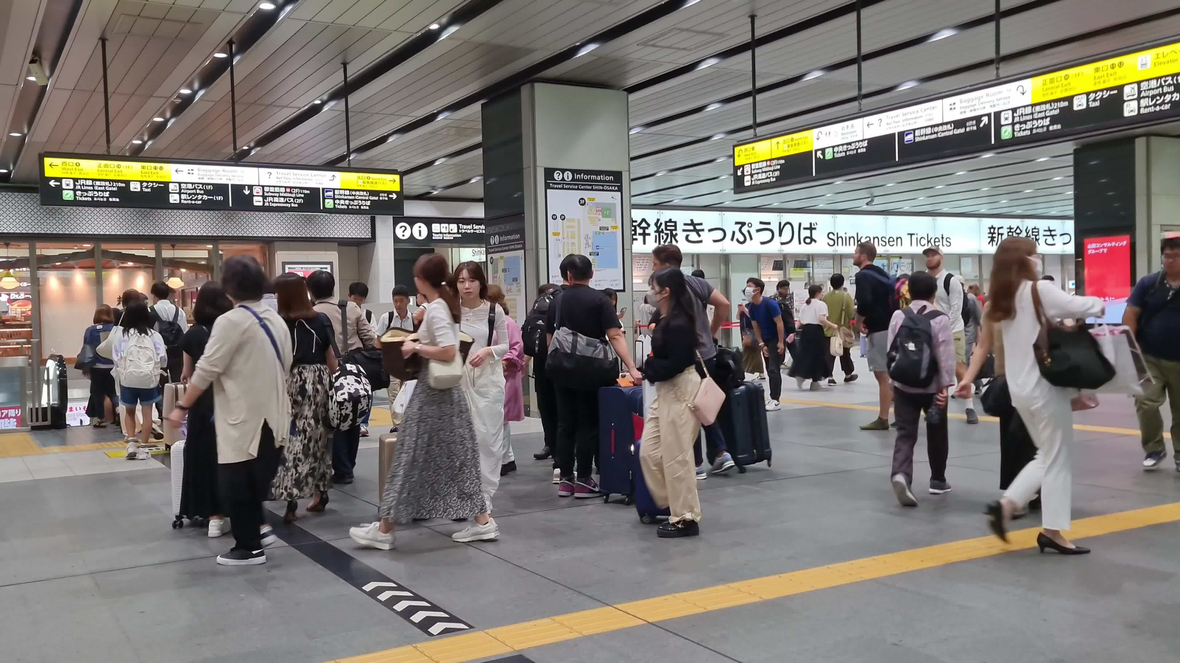Osaka, Japan on September 29 2023. Train passengers at Shin Osaka Station, Some people look in a