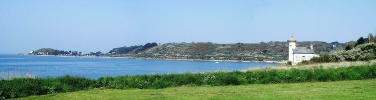 Coastal Beauty Nantouar Lighthouse in Panoramic Splendor   Brittany, France photo