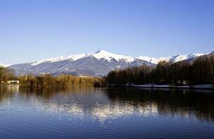 Savoie Splendor Serene Lake and Majestic Mountains in Saint Pierre d'Albigny, France photo