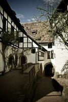 medieval enmaderado casa en exterior callejón, Wartburg castillo, Eisenach, Alemania foto