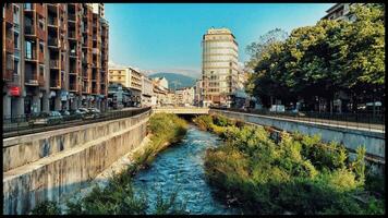 Picturesque View of Leysse River and Cityscape under Sunny Skies, Chambery Savoie photo