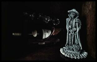 The Ankou   Symbol of Death in Brittany, Calvados Bottle, Glasses, Clair obscur photo