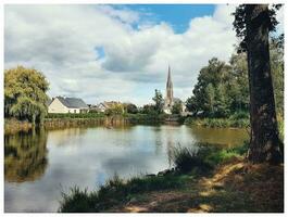 Idyllic French Countryside Village by the Pond photo