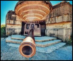 WWII German Bunker Cannon in Normandy photo