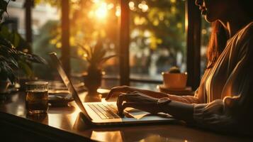 Cropped image of young woman using laptop. Accountant using E invoice software in office. photo