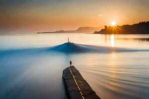 un largo exposición fotografía de un barco en el agua a puesta de sol. generado por ai foto