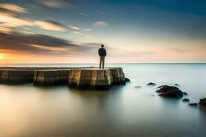 un hombre en pie en un muelle mirando a el océano. generado por ai foto