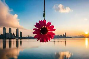a pink flower hanging from a string over a body of water. AI-Generated photo