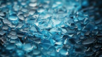 Broken glass close-up. Blue ice background. photo